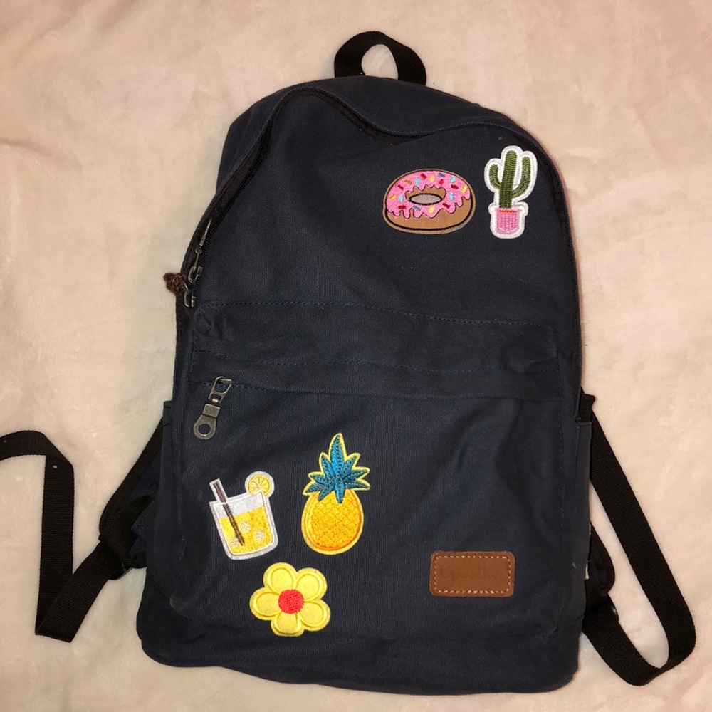 CANVAS BACKPACK W/ PATCHES ( charging station )